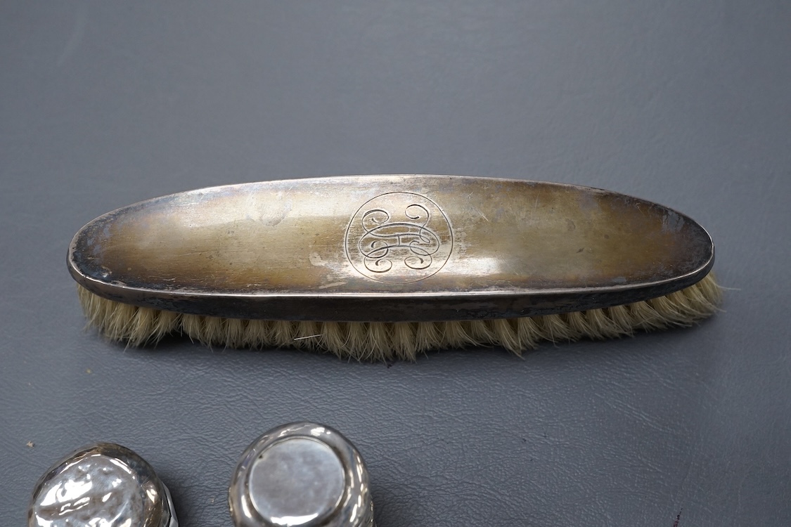 A George V oval silver trinket box, Adie Bros. Birmingham, 1922, 10.8cm, together with a silver compact, four assorted silver mounted toilet jars and a silver mounted hair brush.